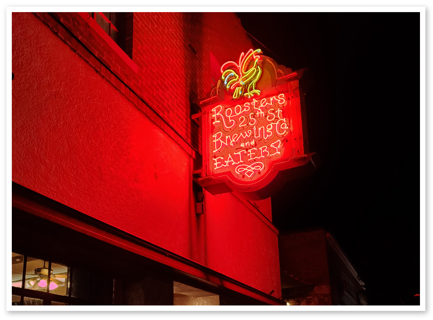Roosters Sign at Night